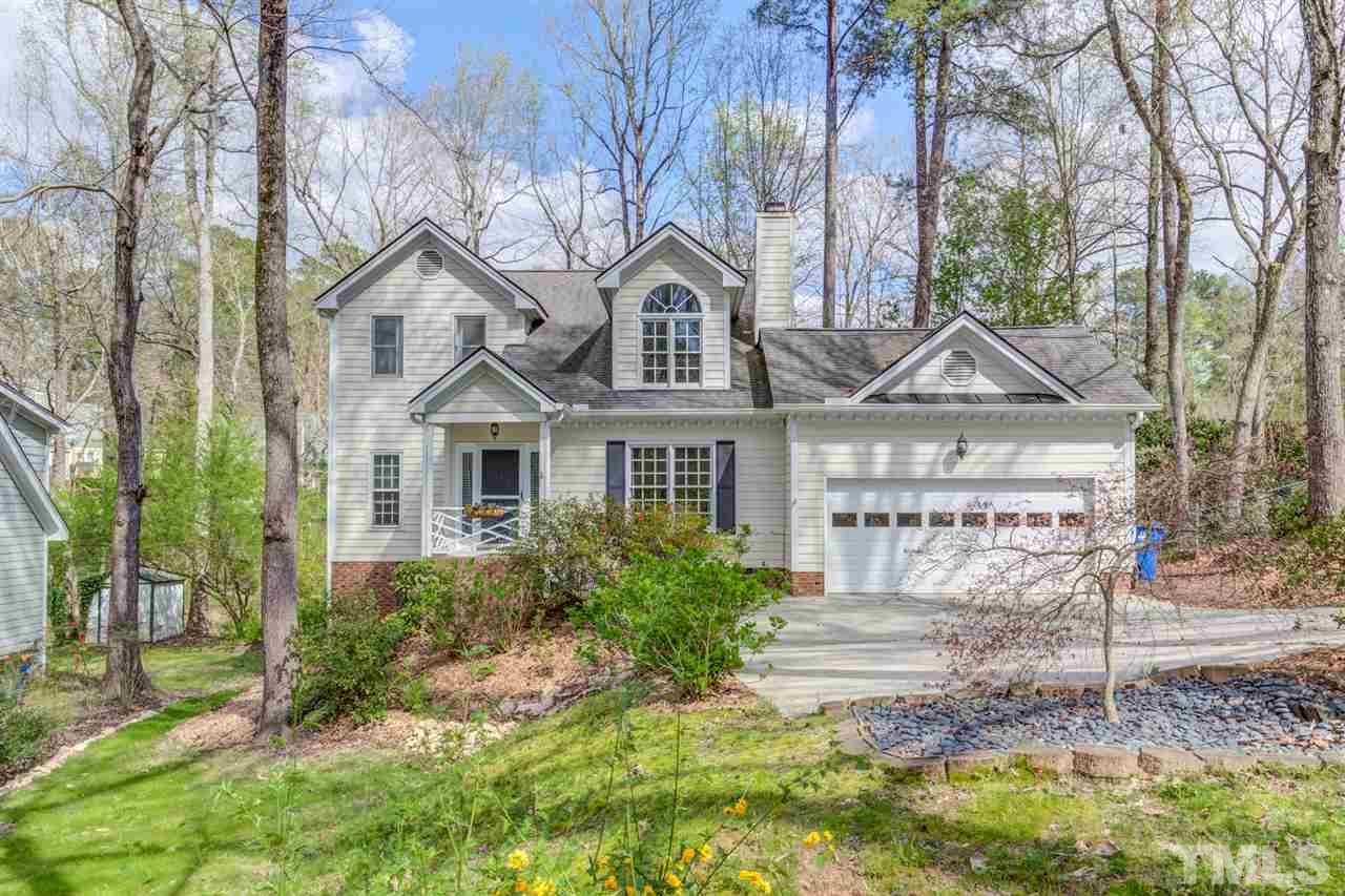 6908 Spring Drive Raleigh, NC 27613 - Photo 1 of 30 a front view of a house with garden