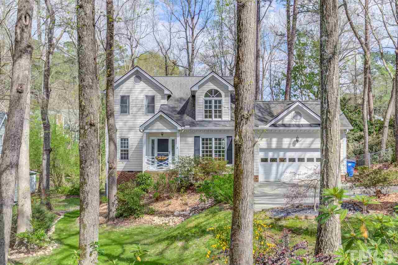 6908 Spring Drive Raleigh, NC 27613 - Photo 2 of 30 a front view of a house with a garden