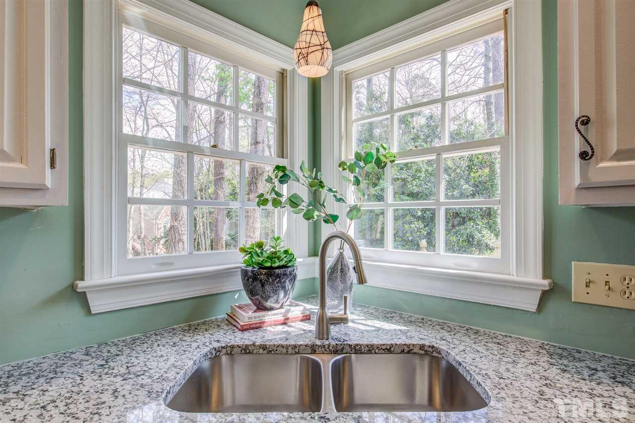 6908 Spring Drive Raleigh, NC 27613 - Photo 13 of 30 a kitchen with a sink and a window