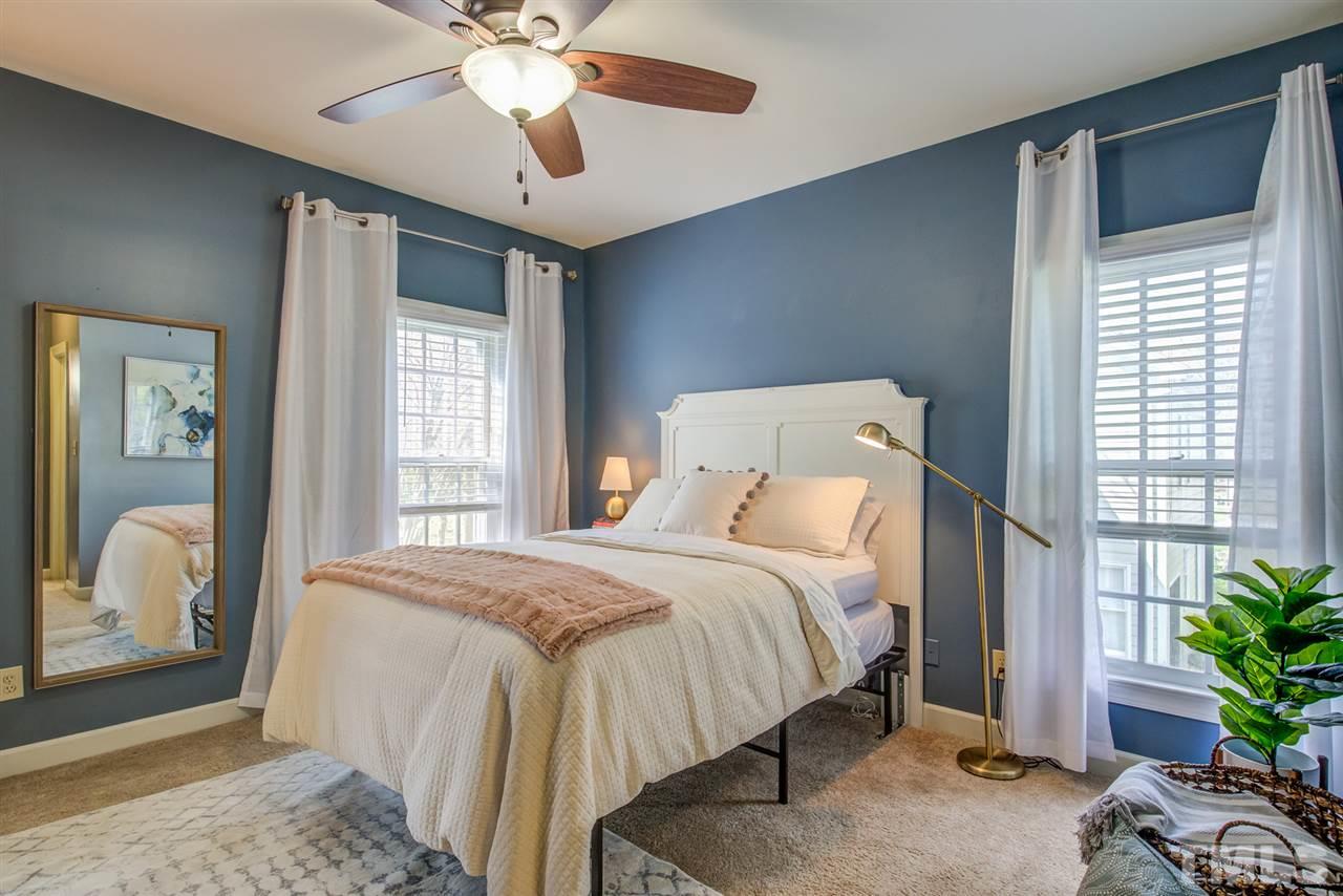 6908 Spring Drive Raleigh, NC 27613 - Photo 16 of 30 a bedroom with a bed and a window