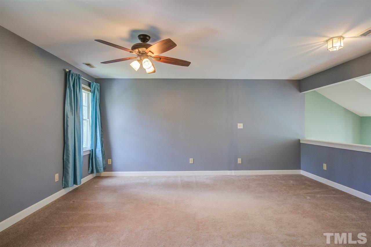 6908 Spring Drive Raleigh, NC 27613 - Photo 19 of 30 a view of a livingroom with a ceiling fan and window