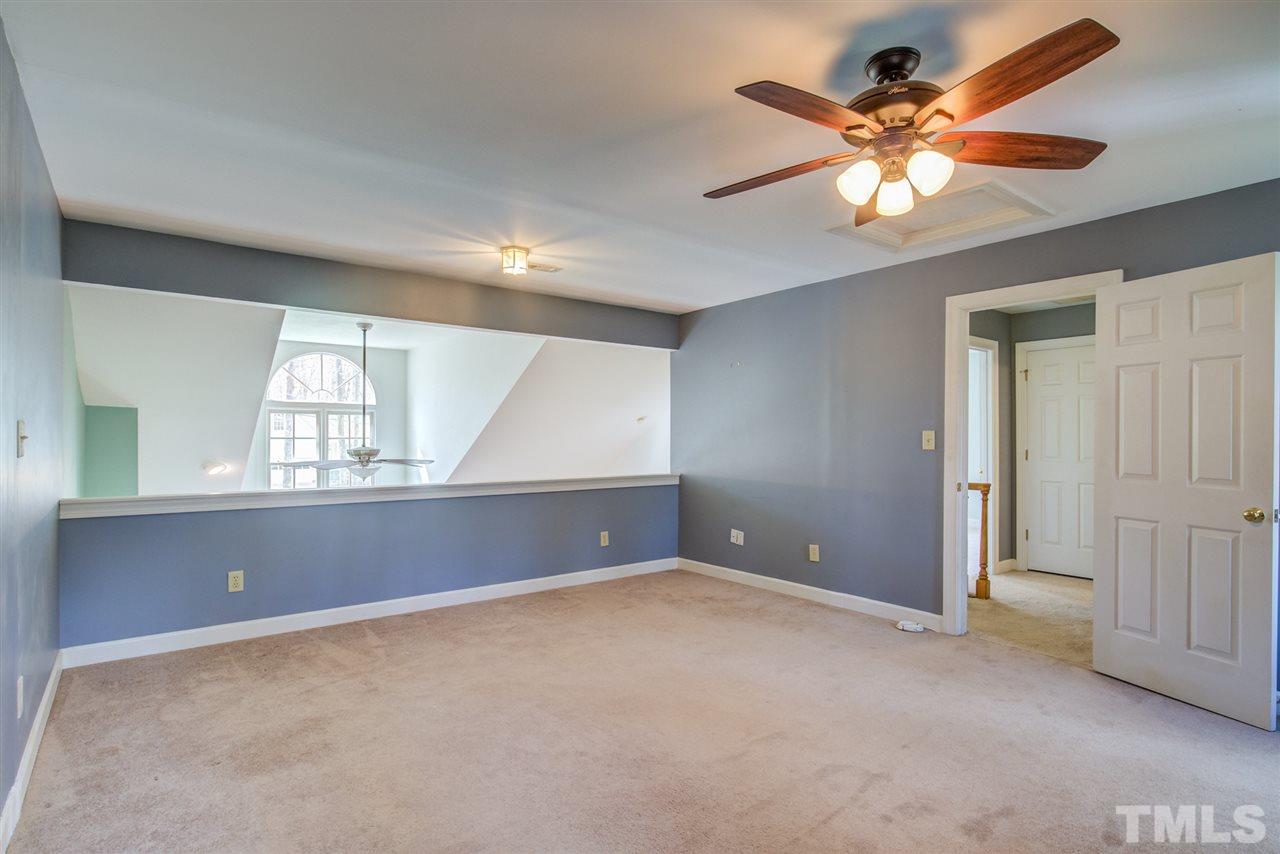 6908 Spring Drive Raleigh, NC 27613 - Photo 20 of 30 an empty room with windows and fan