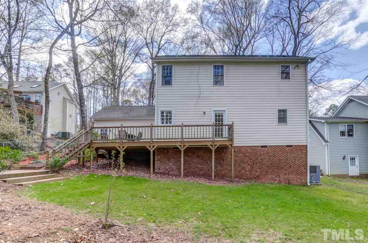 6908 Spring Drive Raleigh, NC 27613 - Photo 29 of 30 a view of a house with a backyard