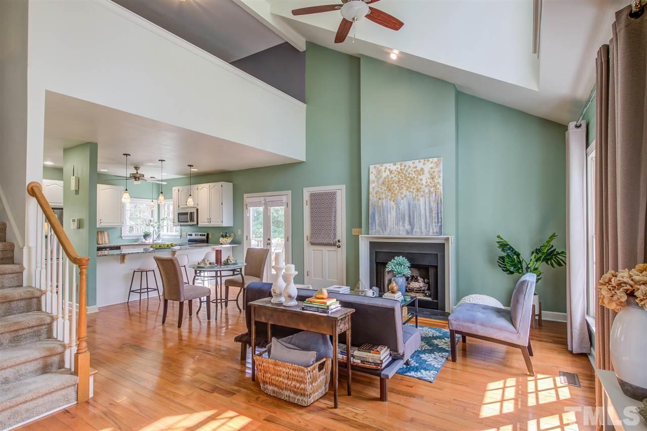 6908 Spring Drive Raleigh, NC 27613 - Photo 5 of 30 a view of a livingroom with furniture window and wooden floor