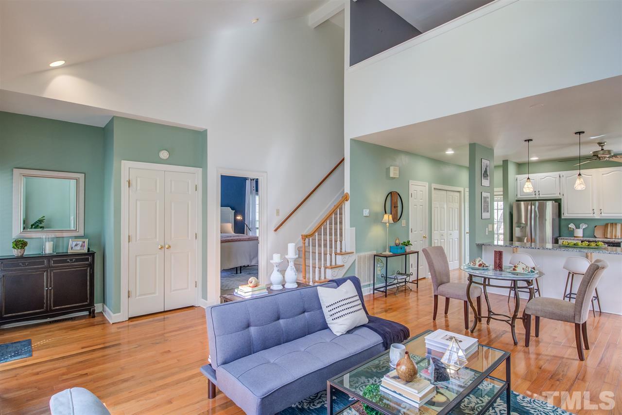 6908 Spring Drive Raleigh, NC 27613 - Photo 7 of 30 a living room with furniture and a wooden floor
