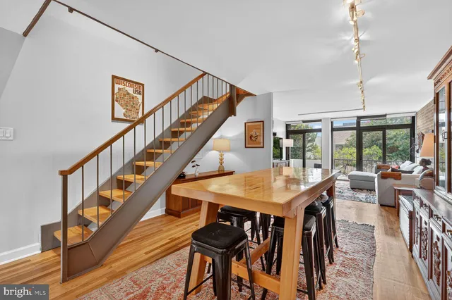 a view of a dining room with furniture window and wooden floor
