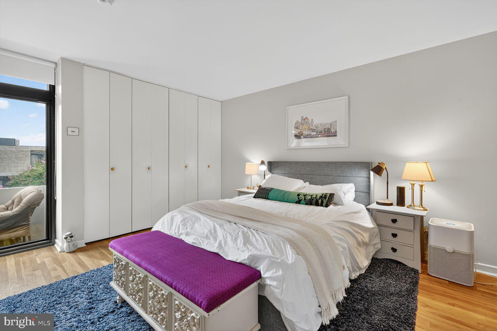 333 N Street Southwest, Unit 333 Washington, DC 20024 - Photo 11 of 20 a bedroom with a bed and a dresser with mirror