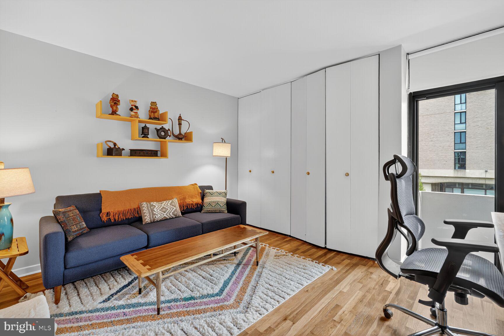 333 N Street Southwest, Unit 333 Washington, DC 20024 - Photo 14 of 20 a living room with furniture and a wooden floor