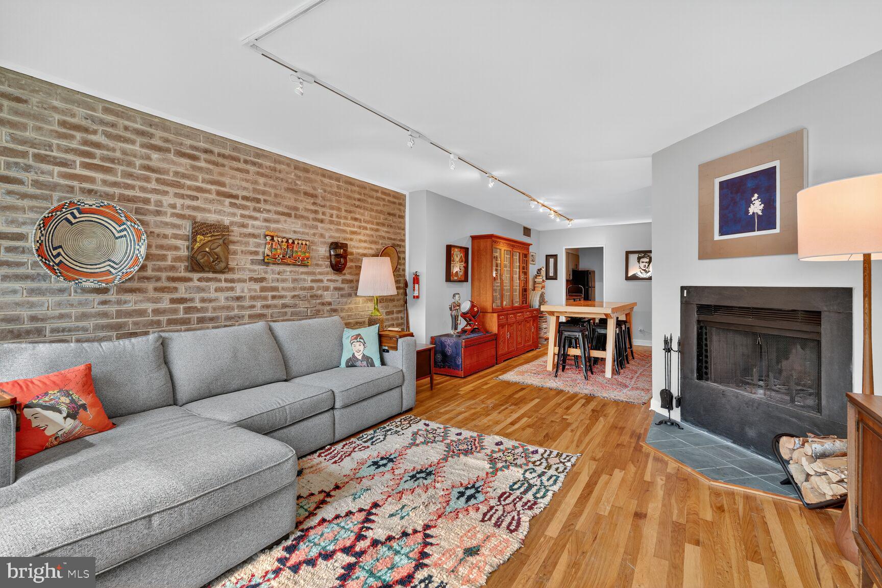 333 N Street Southwest, Unit 333 Washington, DC 20024 - Photo 5 of 20 a living room with furniture and a fireplace