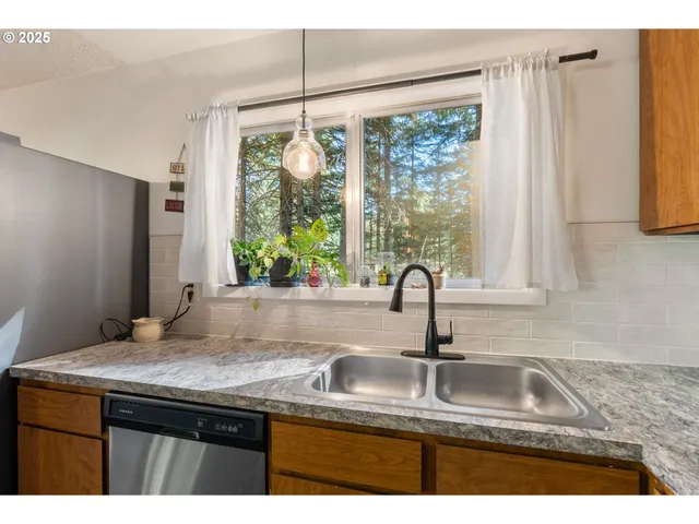 a living room with fireplace furniture and a window