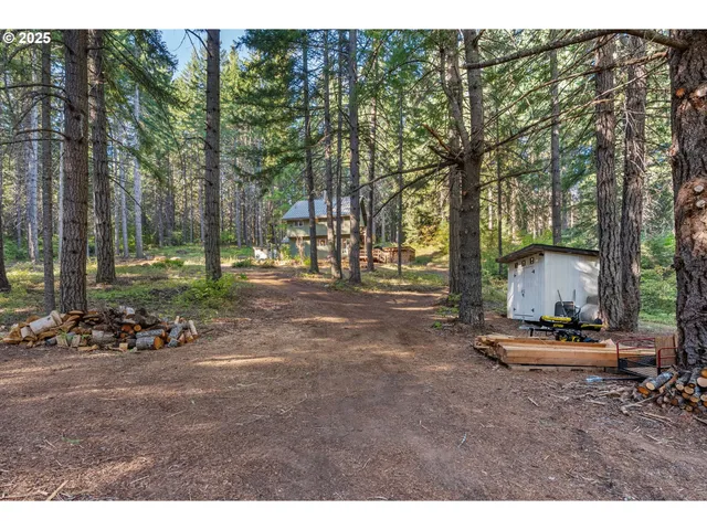 a view of a house with a yard and deck