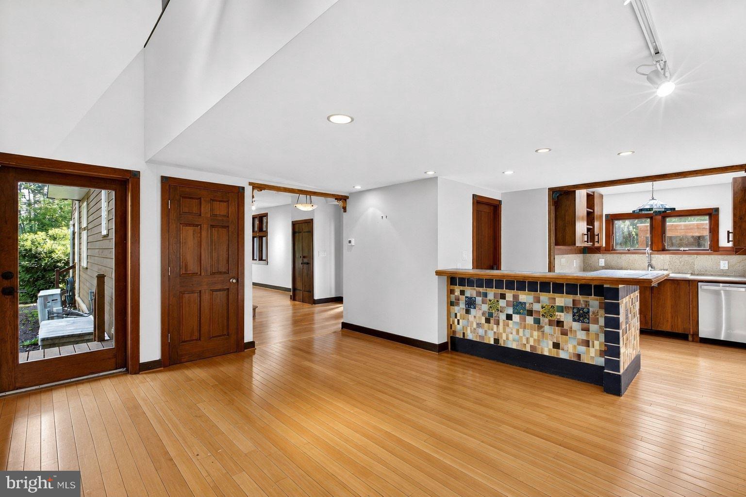 498 Perrineville Road Robbinsville, NJ 08691 - Photo 7 of 59 a view of an empty room with window and wooden floor