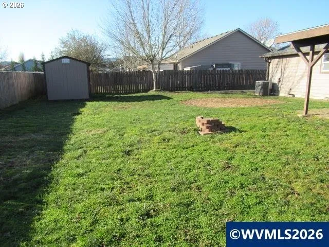 a house with green field in front of it