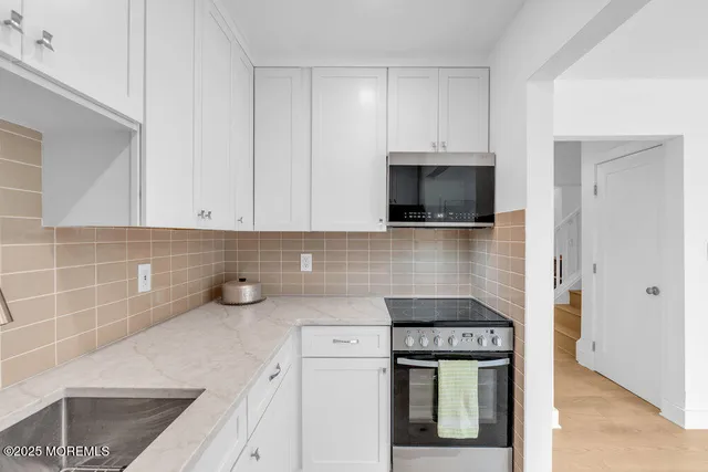 a white refrigerator freezer sitting in a kitchen