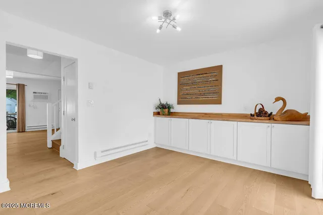 a bedroom with bed and a window