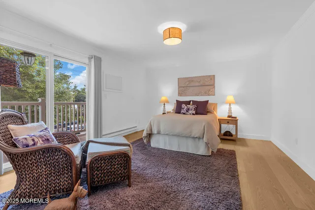 a bedroom with a bed and dresser