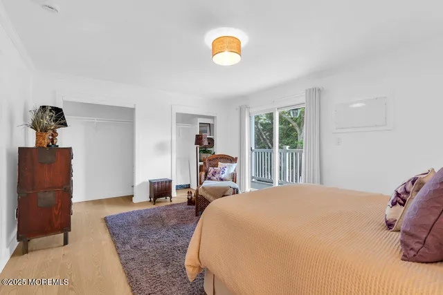 a bedroom with bed and furniture