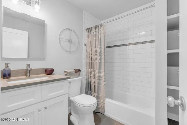 a living room with furniture and potted plant