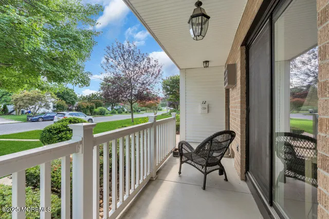 a view of a chair and table in the balcony