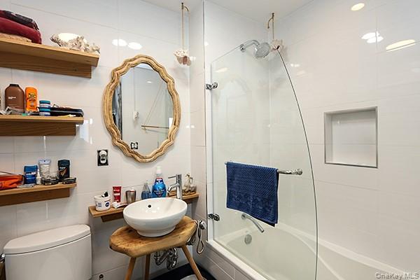 63-34 Fresh Pond Road, Unit 5C Queens, NY 11385 - Photo 12 of 29 Bathroom featuring tiled shower / bath combo and a sink