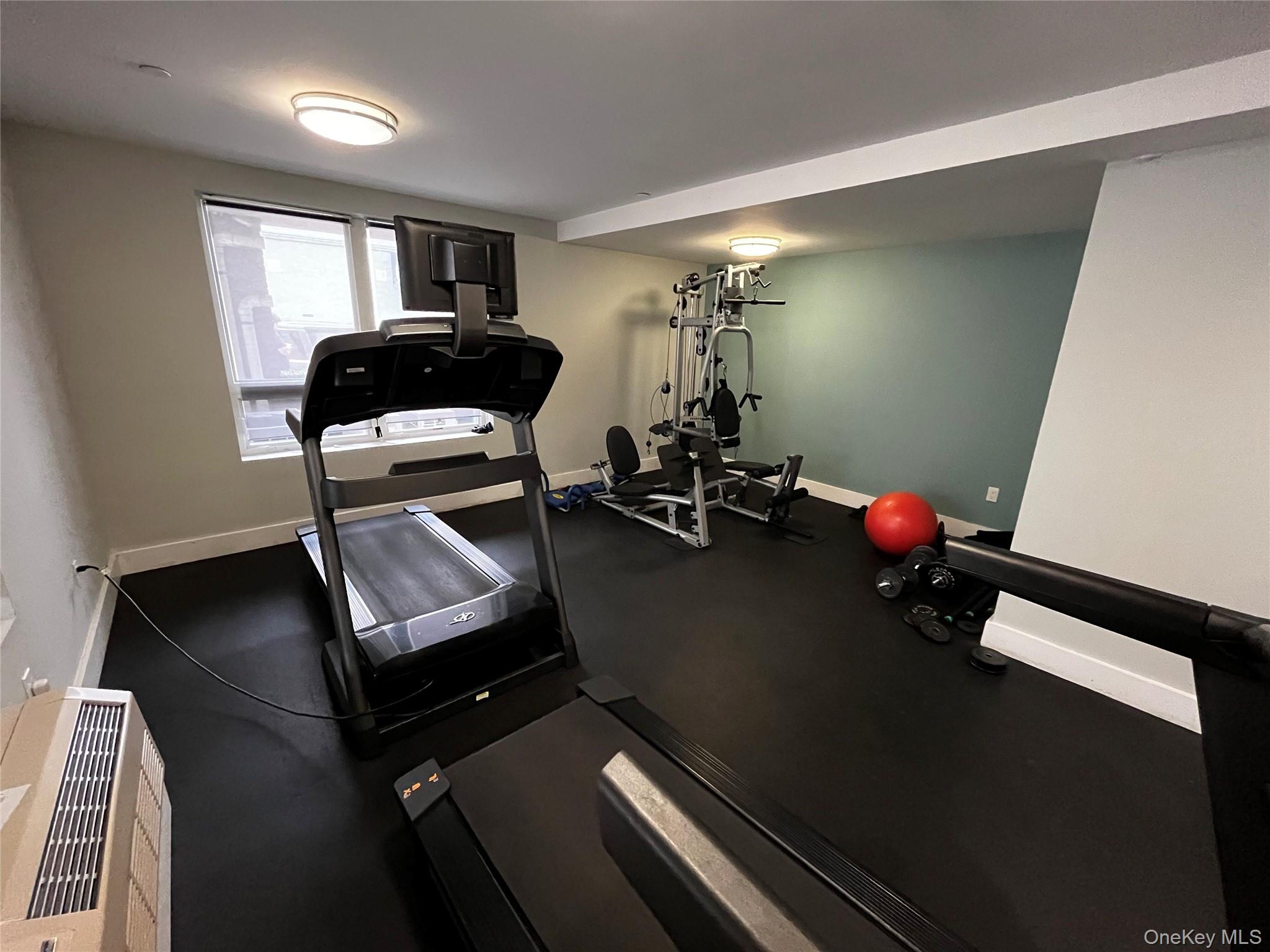 63-34 Fresh Pond Road, Unit 5C Queens, NY 11385 - Photo 27 of 29 Exercise room with baseboards and rubber floors