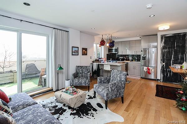 63-34 Fresh Pond Road, Unit 5C Queens, NY 11385 - Photo 3 of 29 Living area with recessed lighting and light wood-style flooring