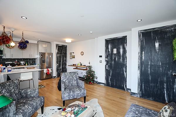 63-34 Fresh Pond Road, Unit 5C Queens, NY 11385 - Photo 4 of 29 Living room with light wood-type flooring and recessed lighting
