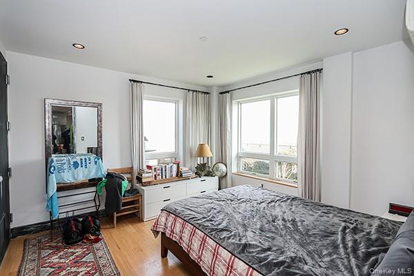 63-34 Fresh Pond Road, Unit 5C Queens, NY 11385 - Photo 10 of 29 Bedroom featuring light wood-type flooring and recessed lighting