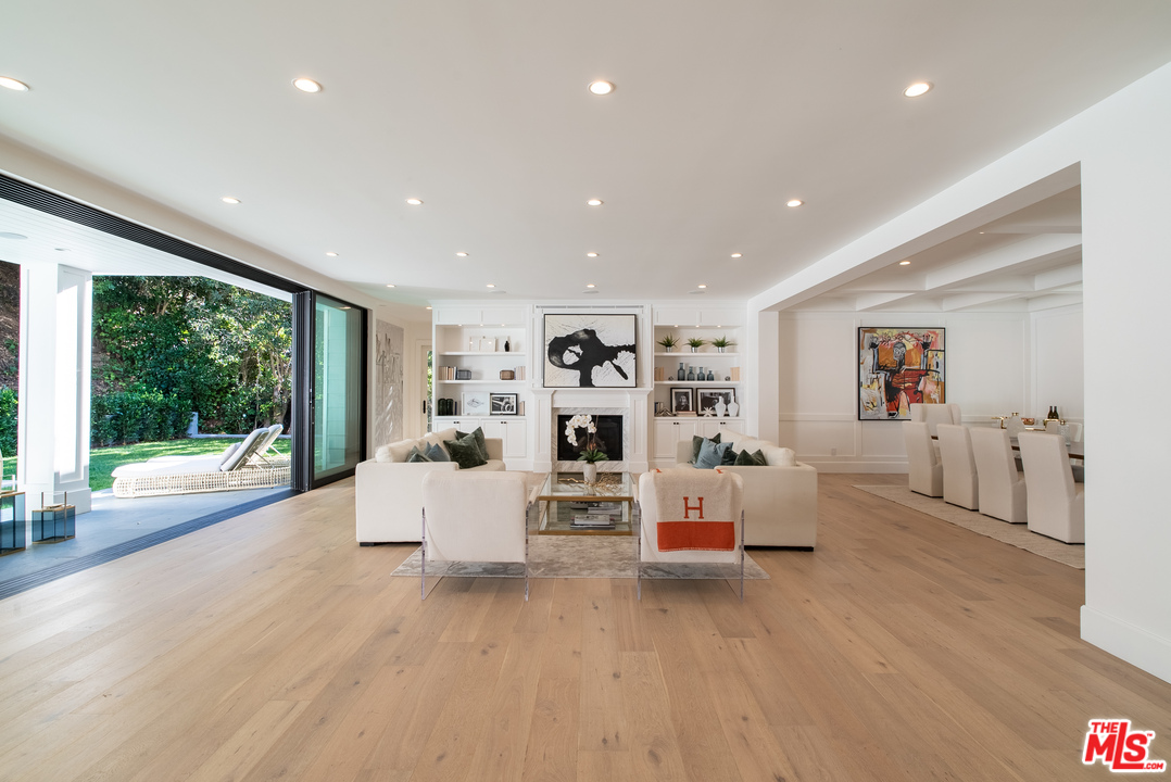 2794 Mandeville Canyon Road Los Angeles, CA 90049 - Photo 4 of 18 a living room with furniture and wooden floor