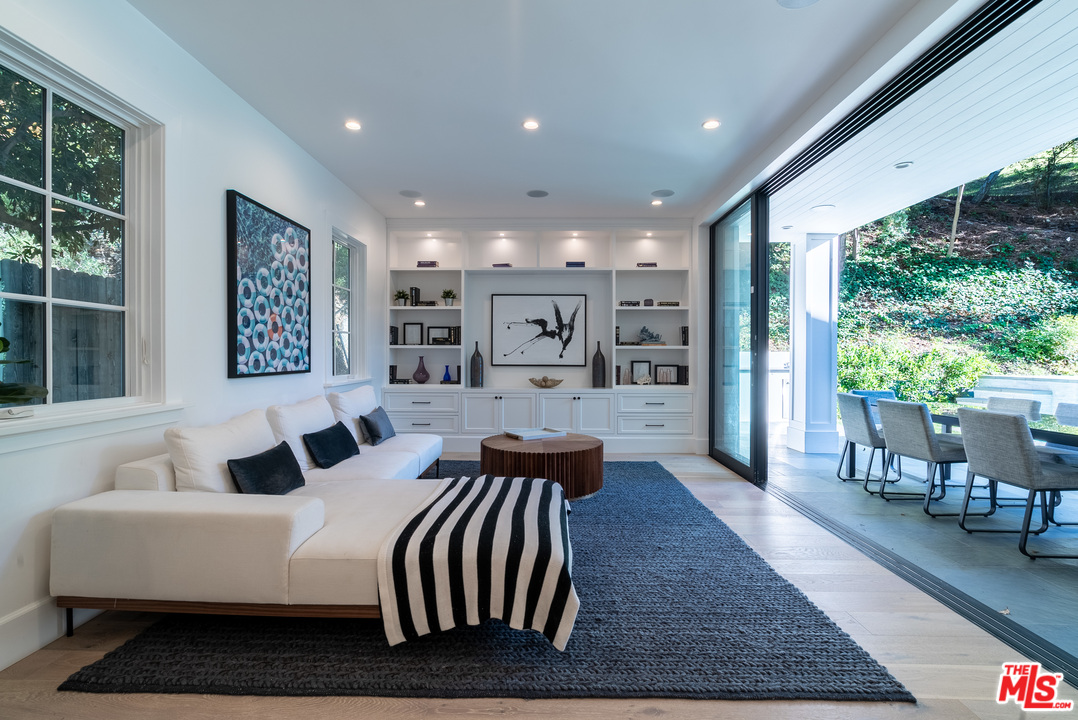 2794 Mandeville Canyon Road Los Angeles, CA 90049 - Photo 9 of 18 a living room with furniture and a large window