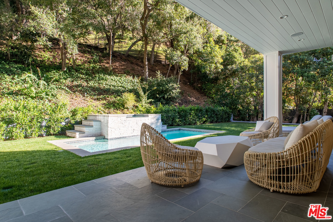 2794 Mandeville Canyon Road Los Angeles, CA 90049 - Photo 10 of 18 a garden view with a seating space