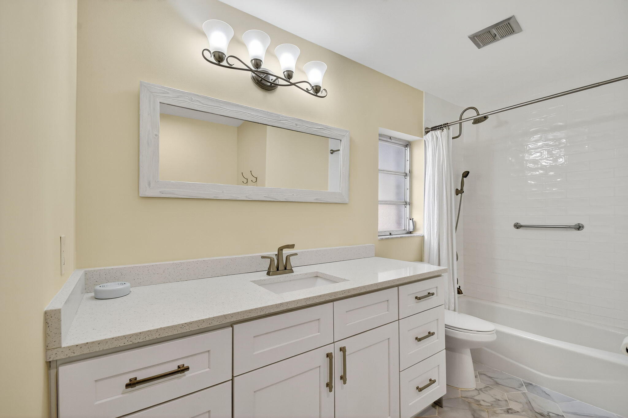 324 Orange Tree Drive, Unit 5 Atlantis, FL 33462 - Photo 13 of 29 a bathroom with a sink double vanity granite tub toilet and shower