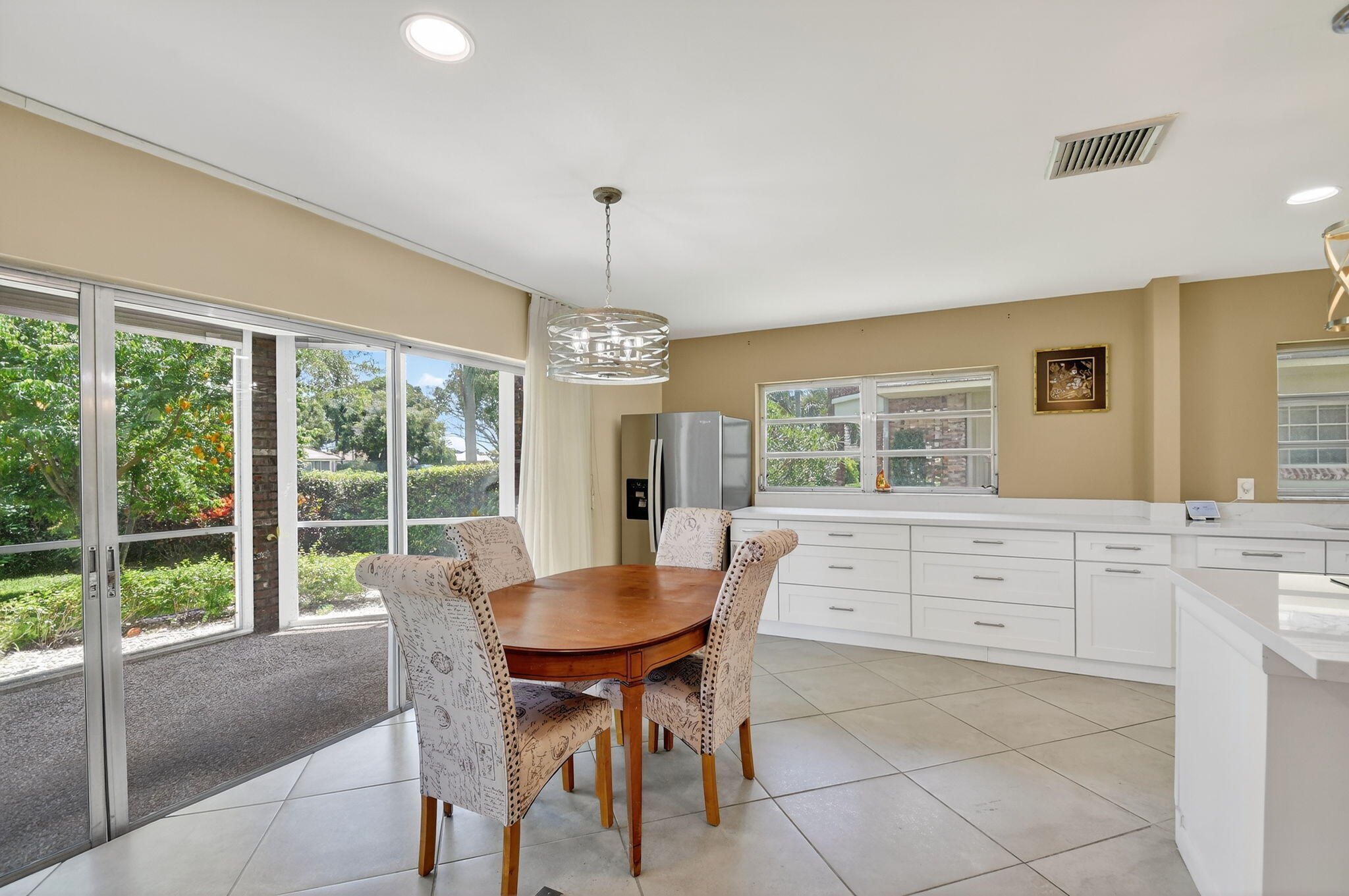 324 Orange Tree Drive, Unit 5 Atlantis, FL 33462 - Photo 4 of 29 a view of a dining room with furniture window and outside view