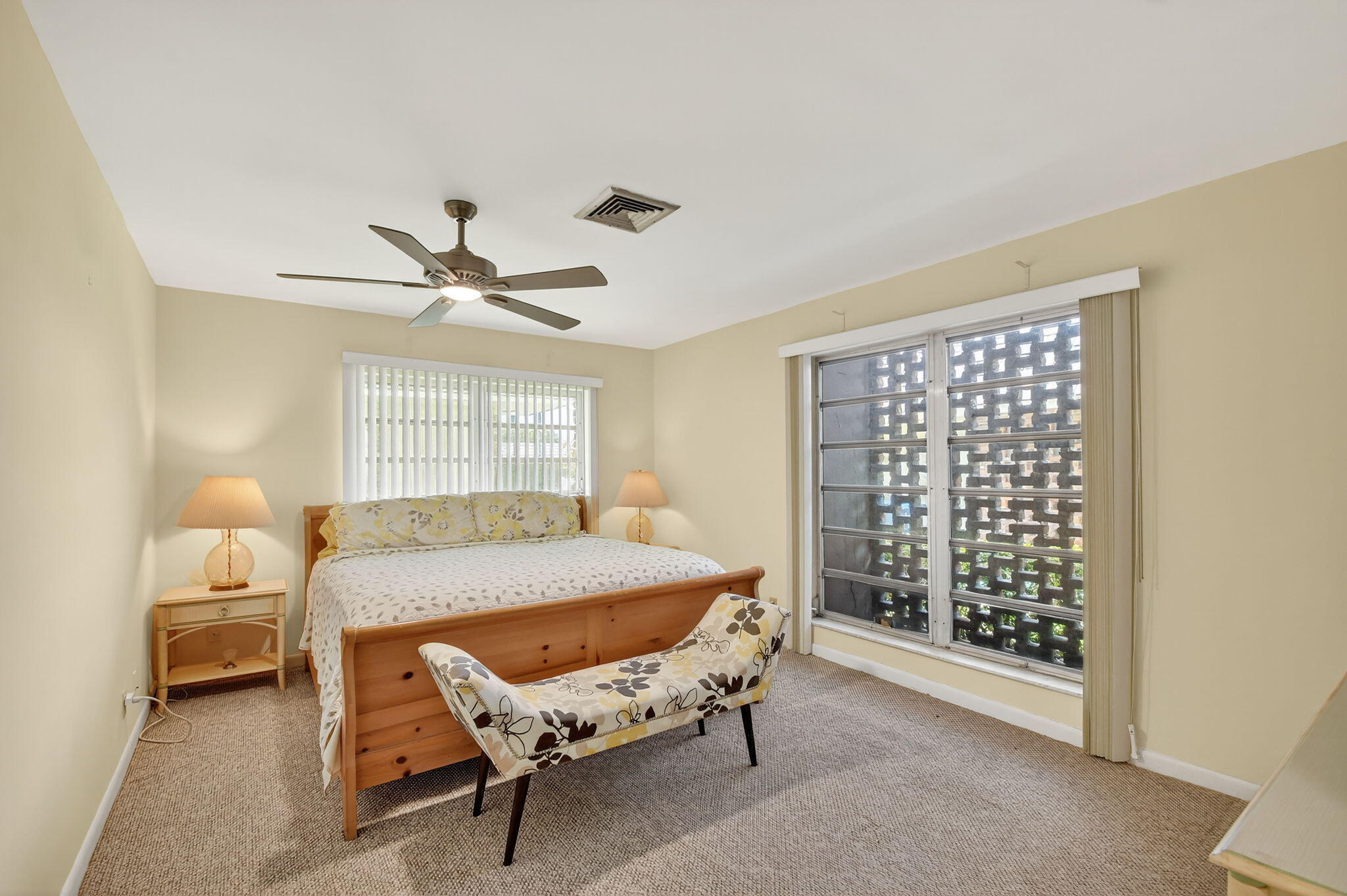 324 Orange Tree Drive, Unit 5 Atlantis, FL 33462 - Photo 10 of 29 a living room with a bed furniture and a window