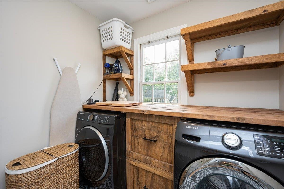 7404 Wilderness Road Raleigh, NC 27613 - Photo 22 of 29 Laundry Room washer and dryer convey