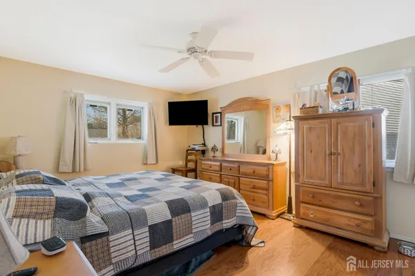 a bedroom with a bed and a dresser