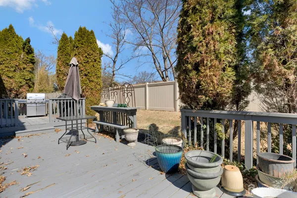 a view of balcony with furniture and potted plants