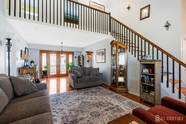 a living room with furniture or couch and a book shelf