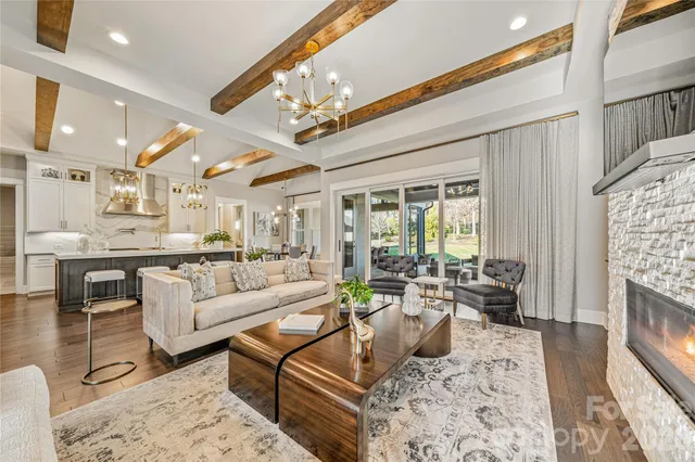 a kitchen with a sink cabinets and wooden floor