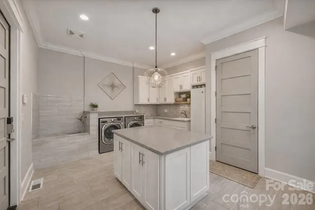 a spacious bedroom with a bed and a large window