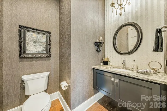 a bathroom with a shower and mirror