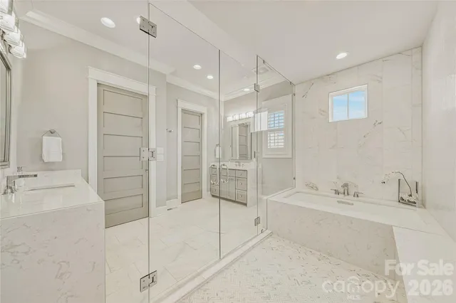 a bathroom with a granite countertop toilet a sink and a mirror