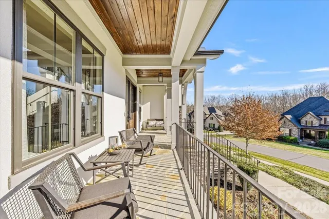 a view of a balcony with chairs