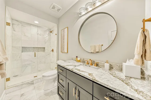 a living room with furniture and flat screen tv