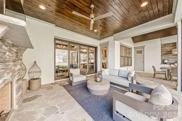 an aerial view of residential houses with outdoor space and swimming pool