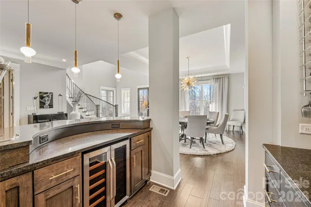 a large white kitchen with a large window