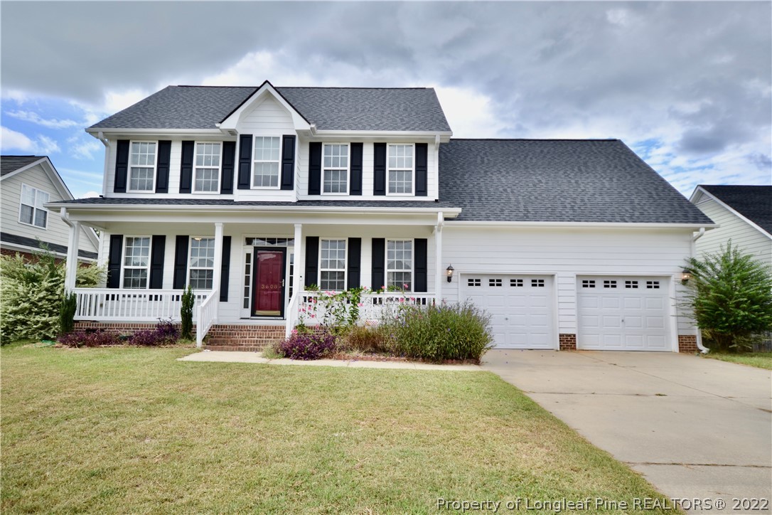 3608 Talus Road Fayetteville, NC 28306 - Photo 1 of 46 a front view of a house with garden