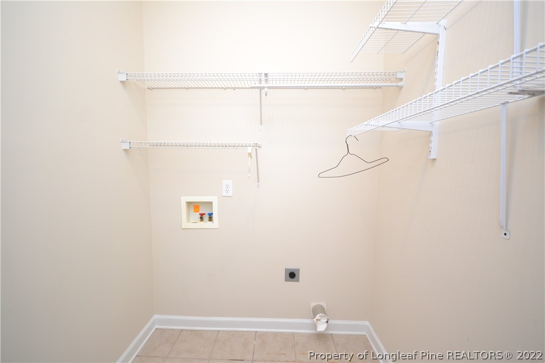 3608 Talus Road Fayetteville, NC 28306 - Photo 22 of 46 a view of small space with empty racks on the wall