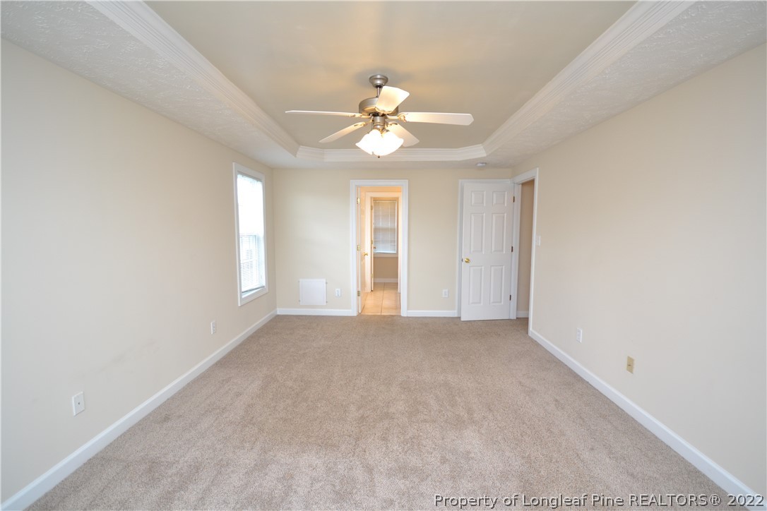 3608 Talus Road Fayetteville, NC 28306 - Photo 25 of 46 an empty room with a window and a fan