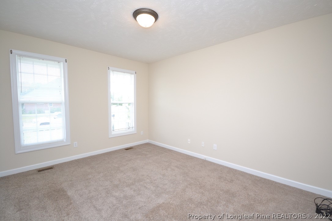 3608 Talus Road Fayetteville, NC 28306 - Photo 3 of 46 an empty room with a window